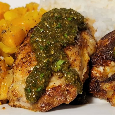 Homemade piri piri chicken with a cilantro and pepper based sauce.