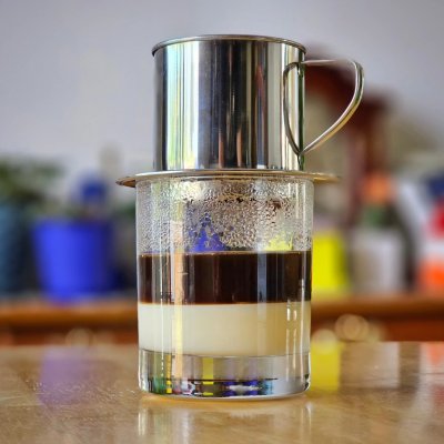 Cà phê đá (Vietnamese iced coffee).
Dark roast on sweetened condensed milk stirred and poured over a cup of ice.